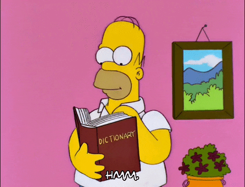 Homer Simpson consulte un dictionnaire